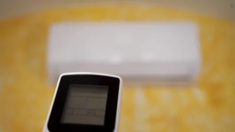 Room temperature changing with remote control activate and deactivate a air Video stock 129337473