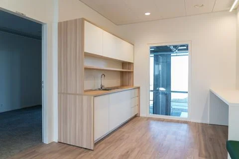 In a room there is a kitchen Stock Photos