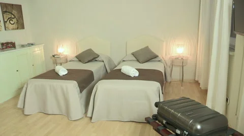 A room with two single beds and a cot Stock Footage 61553553