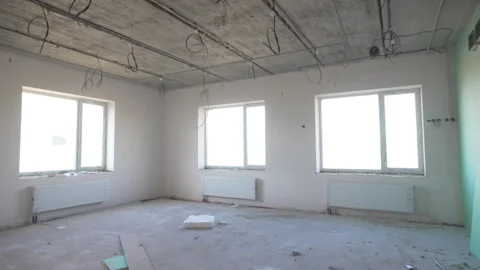 Room in under-construction building with wide windows Stock Footage 310602680
