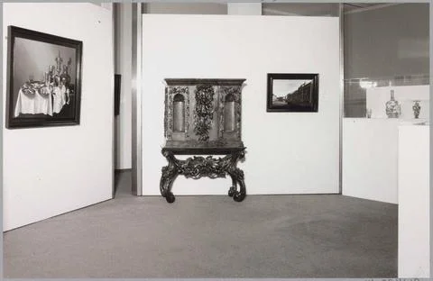 Room with various objects including a cupboard and two paintings; Exhibiti... Stock Photos