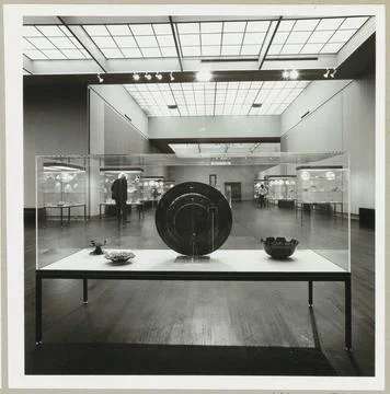 Room with various objects in showcases and two visitors; Exhibition Englis... Stock Photos
