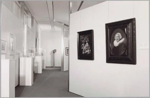 Room with various objects in showcases and two paintings; Exhibition acqui... Stock Photos