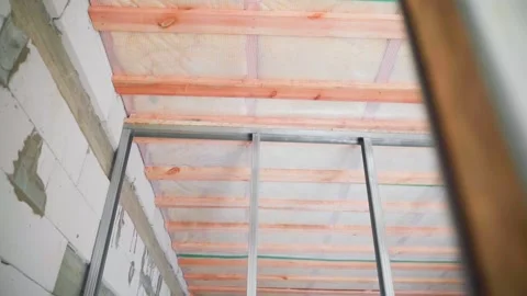 The room is without wall and ceiling cladding and without repair. Camera Stock Footage 239711930