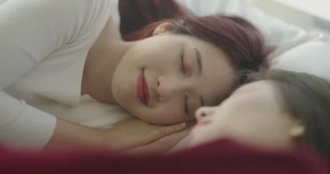 Roommate concept of 4k Resolution. Asian women waking up in bed in the morn.. Video stock 247379823