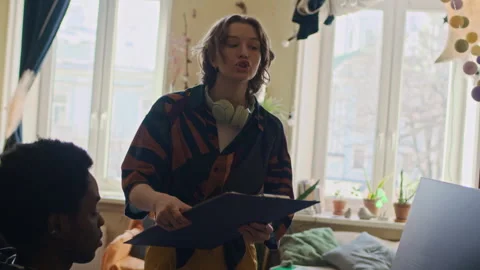 Roommates Arguing about Workspace while Sharing Apartment Stock Footage 334805019