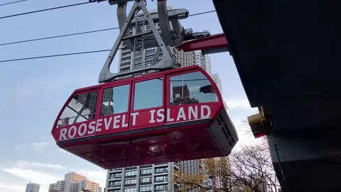 Roosevelt Island Tram returning to the Upper East Side in Manhattan Stock Footage 221272935