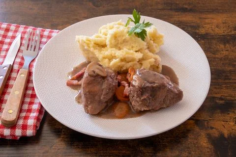 Rooster with mash on a plate Stock Photos