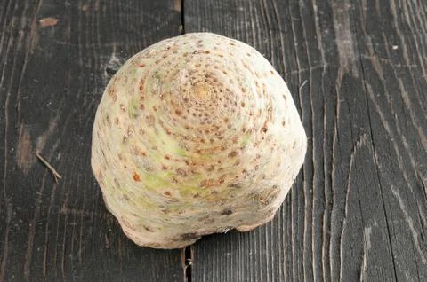 Root of Celery on a wooden table Stock Photos