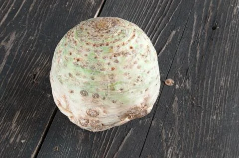 Root of Celery on a wooden table Stock Photos