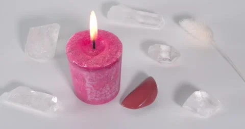 Root chakra candle with red jasper and clear quartz Stock Footage 161379134