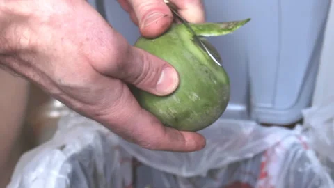 Root vegetable green radish peeling, close up at kitchen Video stock 191616082