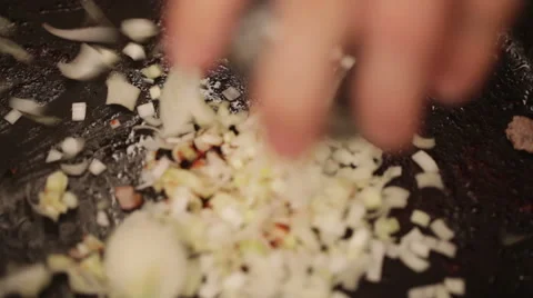 Root vegetable poured into hot pan - closeup Stock Footage 45982738