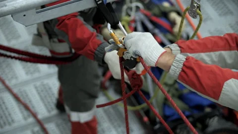 Rope access training with workers adjusting safety system Stock Footage 321408395