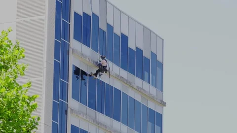 Rope Access Worker Cleaning Glass Office Building 스톡 동영상 329165714