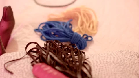 Rope and whip object lying on white simple bed, preparation for session, BDSM ob Stock Footage 294770282