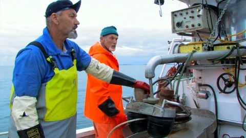A rope attached to a buoy being pulled off the floor of a fishing boat. Stock Footage 103531337