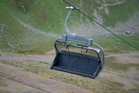 Rope bench by cable car on a background of mountain Stock Photos