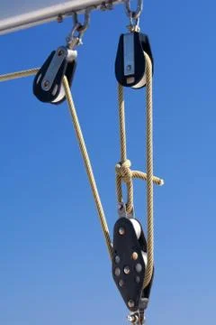 Rope on blocks on blue sky Stock Photos