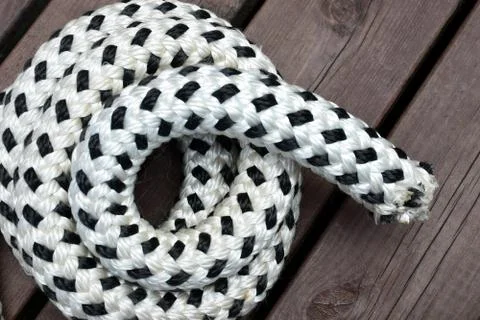 Rope on brown deck Stock Photos