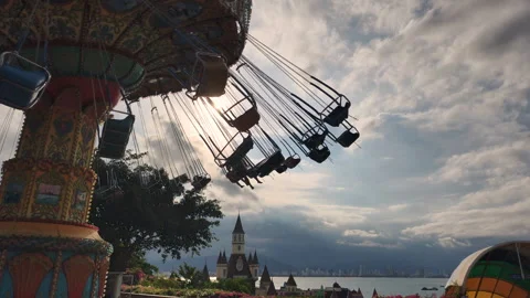 A rope carousel ride against a cloudy sky. Stock Footage 317806783
