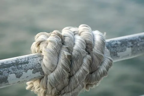 Rope Coiled on Rusty Railing Stock Photos