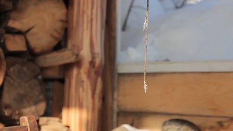 The rope dangles in the wind against the background of firewood Stock Footage 87239892