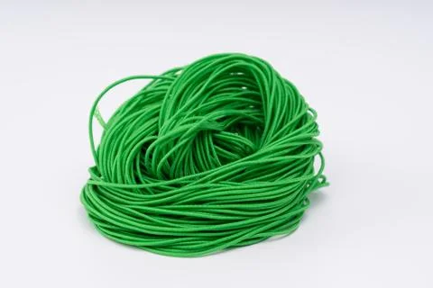 Rope, green rubber rope. Twisted rope beautifully on a white background. Stock Photos