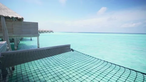Rope hammock in a luxury overwater villa in the Maldives. Stock Footage 201019341
