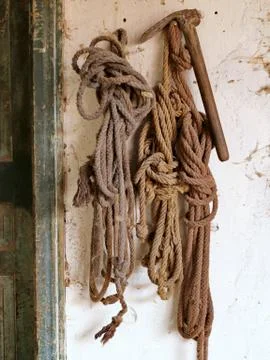 Rope hanging on the wall Stock Photos