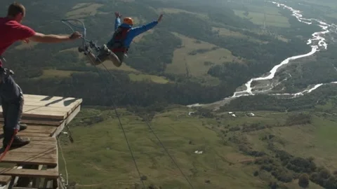 Rope jumping, a man jumps from a mountain, a safe fall from a chip Stock Footage 171870627