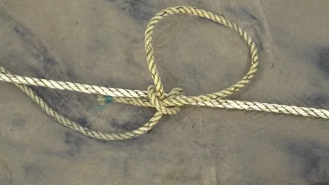 Rope with knot on the beach Stock Footage 286764687