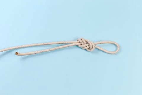Rope knot as ?igure-eight loop on a blue background Stock Photos