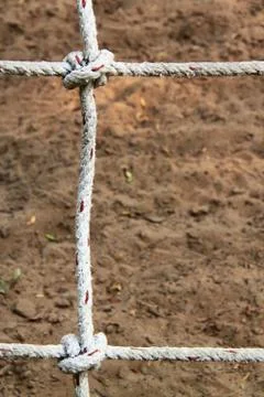 Rope with knots on the background of the sand Stock Photos