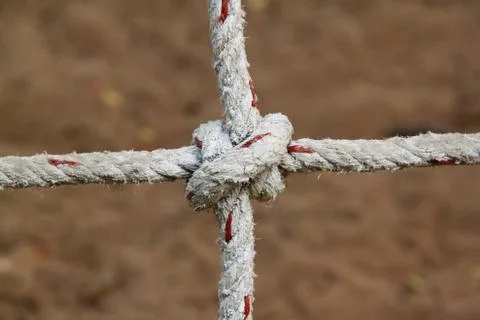 Rope with knots on the background of the sand Stock Photos
