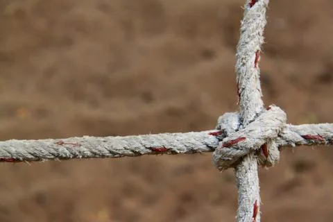 Rope with knots on the background of the sand Stock Photos