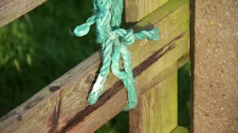 Rope knotted on a fence Stock Footage 10731446