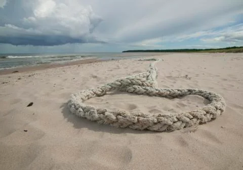 Rope laying in sand.gn Foto stock