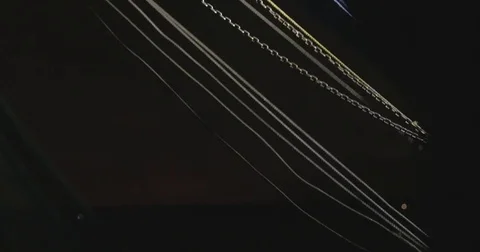 Rope lines on a boat blowing in the wind at night Stock Footage 76678429