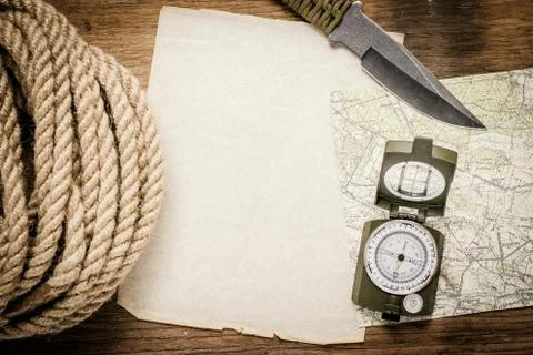 Rope, paper, map, compass and a knife Stock Photos