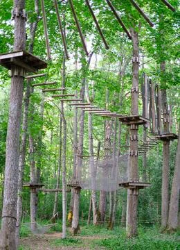 Rope park on trees close-up. The concept of sports and recreation Stock Photos