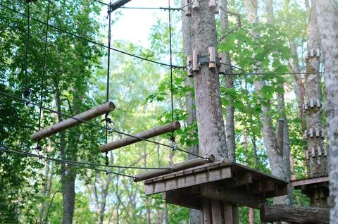 Rope park on trees close-up. The concept of sports and recreation Stock Photos