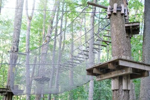 Rope park on trees close-up. The concept of sports and recreation Stock Photos