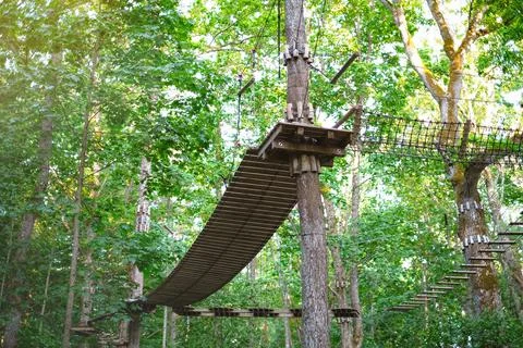 Rope park on trees close-up. The concept of sports and recreation Stock Photos