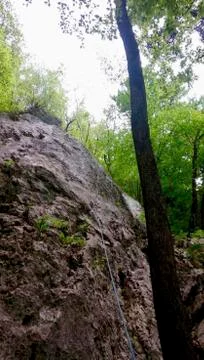 A rope on the rock for climbing Stock Photos