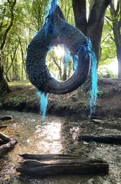 Rope swing over a stream Stock Photos