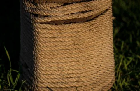 Rope is wound on a log Stock Photos