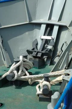 Ropes and other devices on small fishing vessel bow Stock Photos