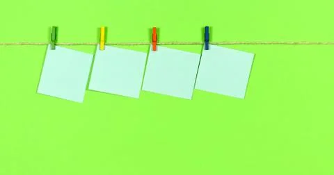 Ropes with clothespins appear notes for notes. Stock Photos