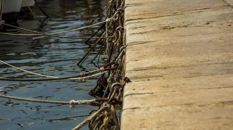 Ropes at a harbor jetty Stock Photos